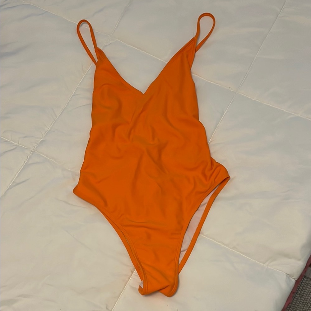 Orange women’s one Piece Swimsuit. Never worn Size small.